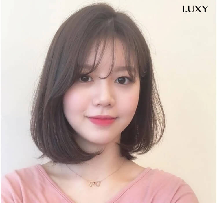 Tóc ngắn ngang vai uốn đuôi cụp ngang vai